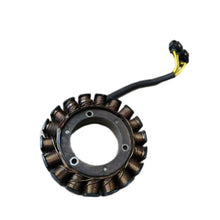 Image of a coil style outboard engine alternator on a white background.