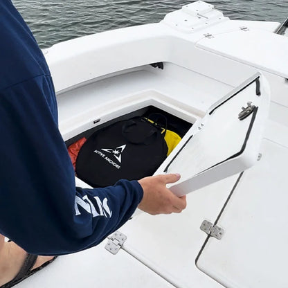 Active Anchors DF400 black anchor carry bag stored inside the rear storage compartment of a recreational motorboat.