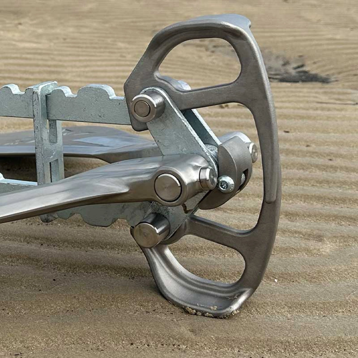 Close-up of the Active Anchors DF500 boat anchor pivot assembly, showing the stainless steel lifter, stopper and connecting pins.
