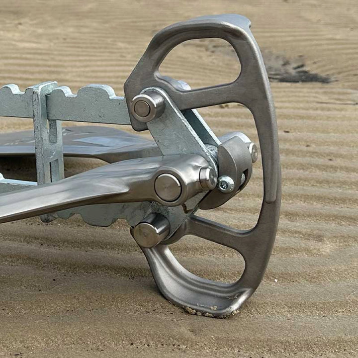 Close-up of the Active Anchors DF600 boat anchor release mechanism, showing the stainless steel lifter, pivot pins and stopper assembly.