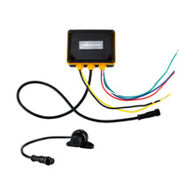 Image of an audio controller box and knob on a white background.