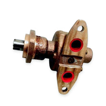Brass water pump showing drive shaft and mounting face with inlet and outlet ports.