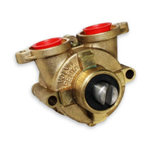 A Volvo Penta mechanical pump assembly made of brass, featuring two red plastic caps on the top and a black and silver central bearing assembly.