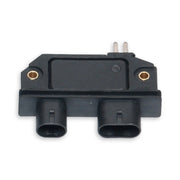 Black ignition module showing two plug connections and two metal pins at the top.