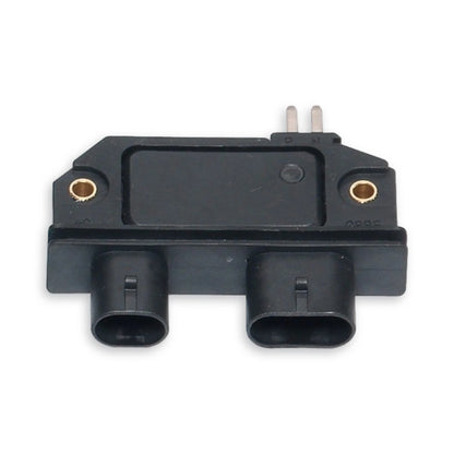 Black ignition module showing two plug connections and two metal pins at the top.