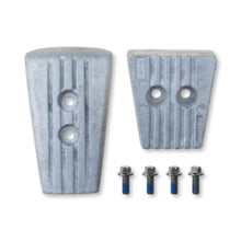 Two aluminium anodes for a volvo penta SXA sterndrive on a white background.