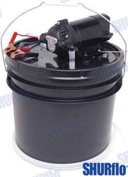 An oil change kit with various components laid out on a black surface, including oil filters and pump parts.