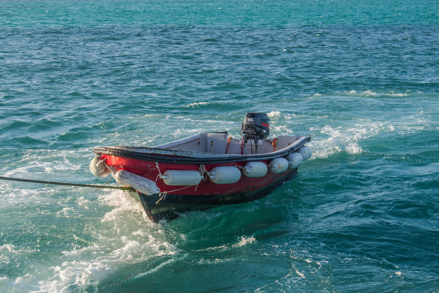 Image of a boat being towed in on the water.